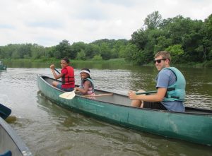 Neill canoeing with campers!